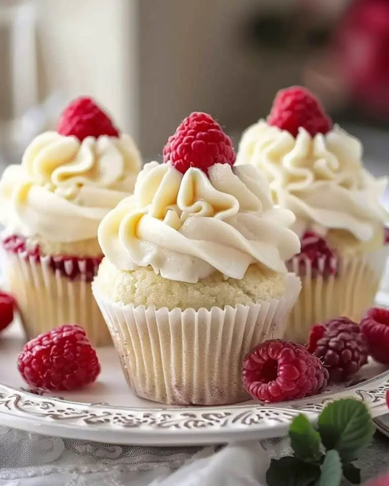 Almond Wedding Cake Cupcakes with Raspberry Filling