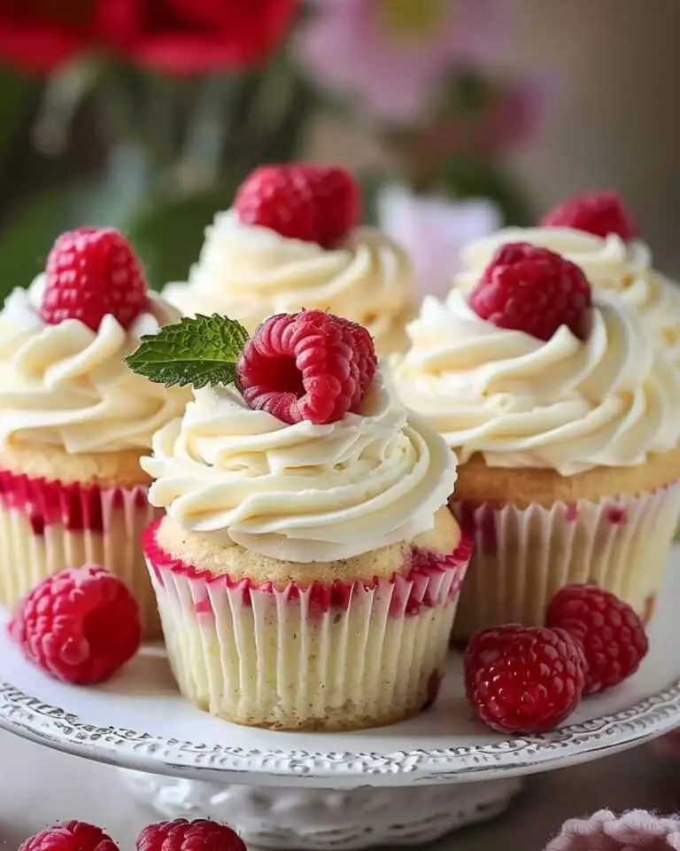 Almond Wedding Cake Cupcakes with Raspberry Filling