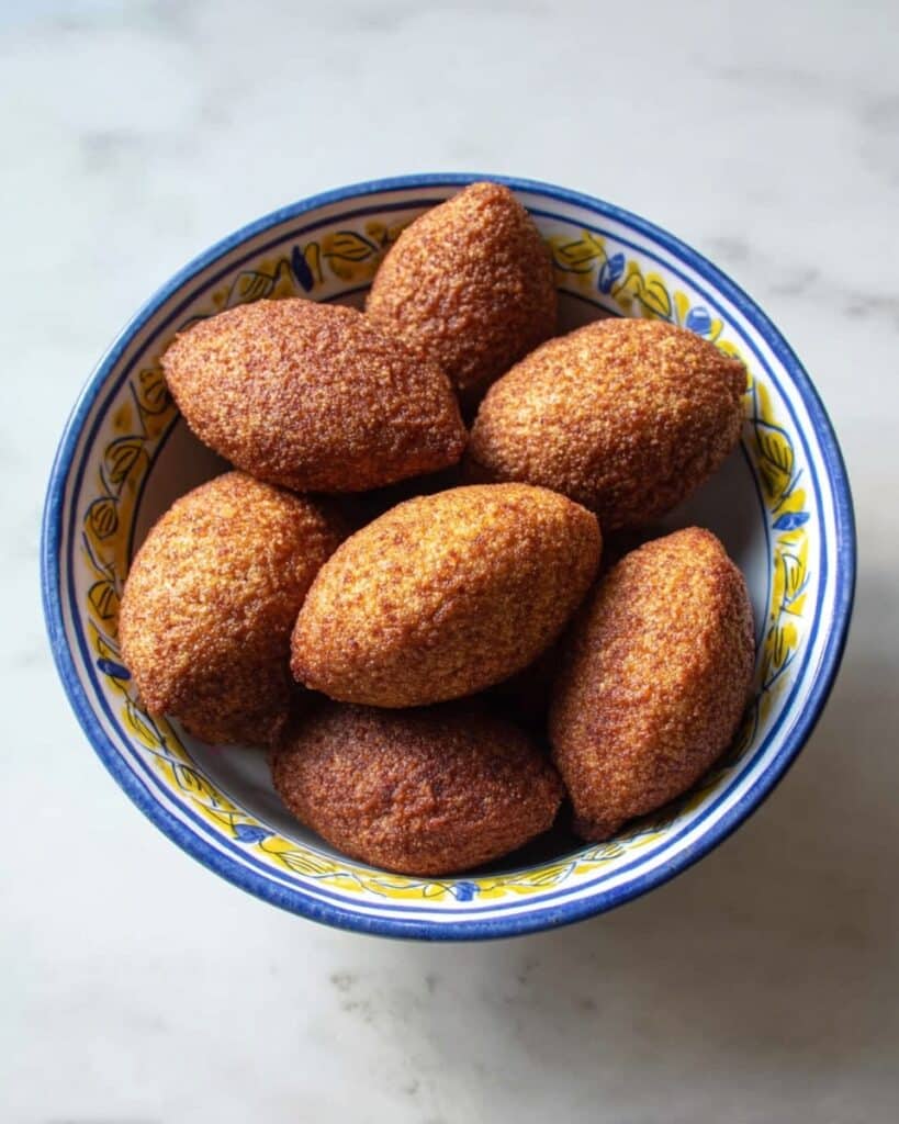 Fried Lebanese Kibbeh Balls with Spiced Meat and Pomegranate Filling Recipe