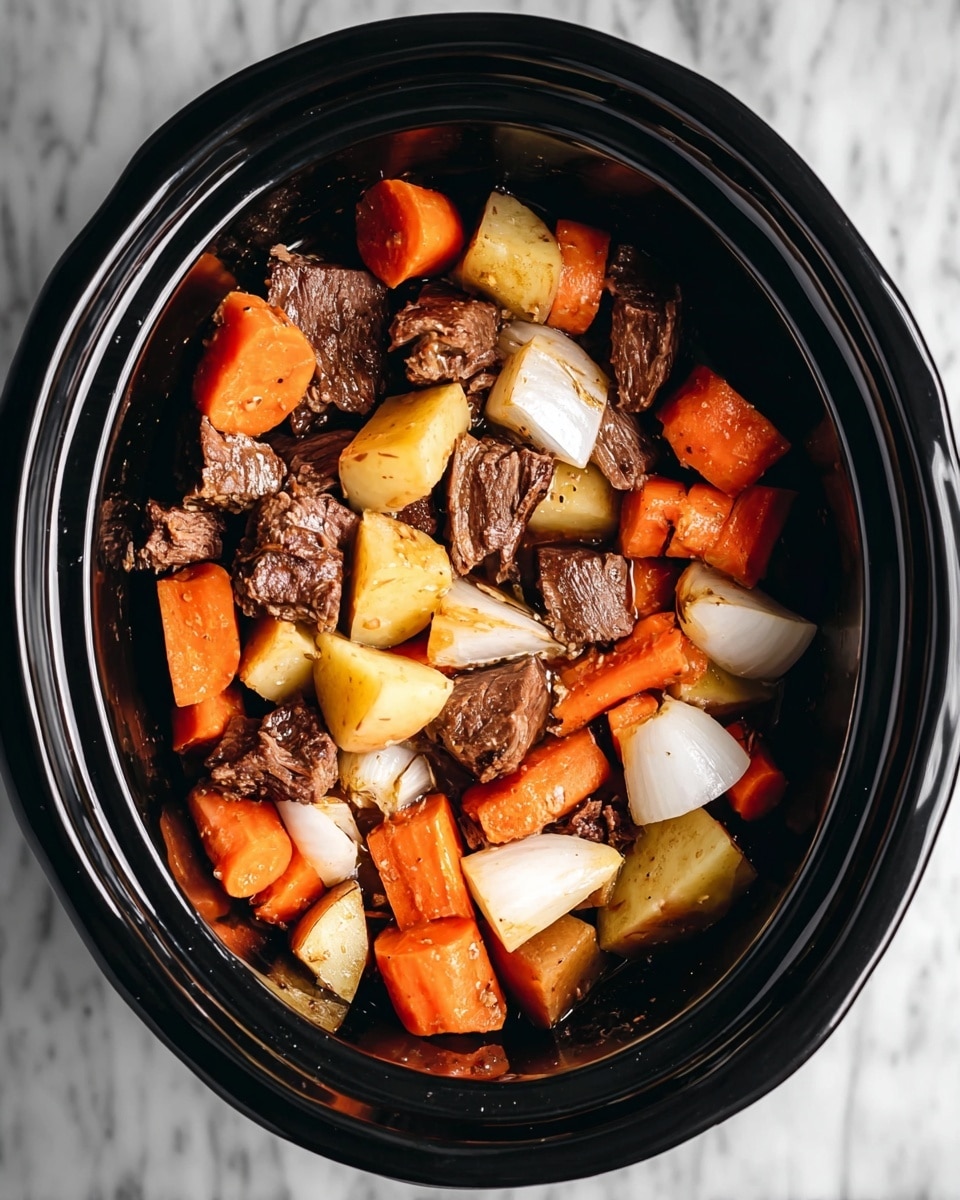 A black slow cooker filled with a mix of thick pieces of brown cooked meat, large chunks of orange carrots, white onion pieces, and pale yellow potato cubes. The ingredients are layered together inside with no specific order, and the slow cooker sits on a white marbled surface. photo taken with an iphone --ar 4:5 --v 7