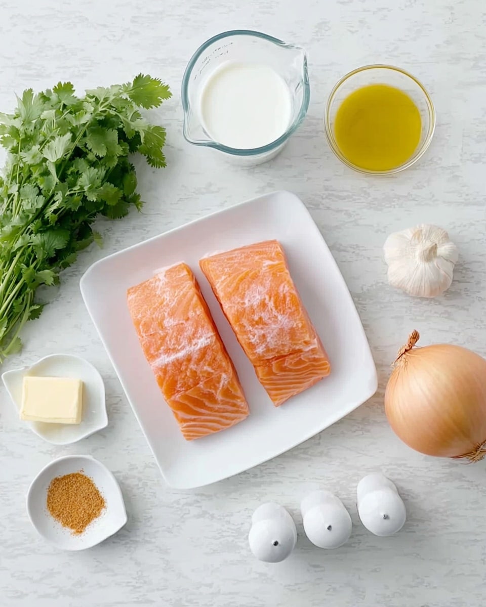 Two pieces of raw salmon with light orange color and white marbling lay side by side on a white rectangular plate in the center. To the top right, a small white dish holds yellow cooking oil, and nearby there are white salt and pepper shakers. A whole yellow onion with a papery outer skin sits next to a peeled single garlic clove on the right. Above the salmon, a clear glass measuring jug contains thick white cream. To the left, fresh green cilantro with leafy texture lies in a bunch. Above the cilantro, a small white dish holds a golden-brown powder spice, and another white dish next to it has a small piece of pale yellow butter. The whole setting is on a white marbled surface. photo taken with an iphone --ar 4:5 --v 7