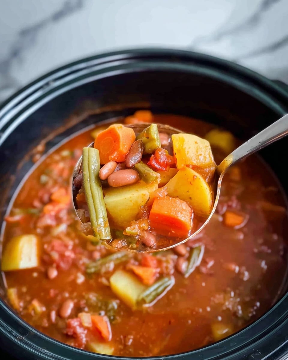 A large black pot filled with a thick soup showing several layers of ingredients: chunks of orange carrots, yellow potatoes, green beans, and small brown beans, all mixed in a rich reddish-brown broth. A silver ladle lifts a spoonful from the pot, holding visible pieces of potato, carrot, green beans, and some beans, showing the texture of the soft vegetables soaked in the thick broth. The background has a white marbled texture. Photo taken with an iphone --ar 4:5 --v 7