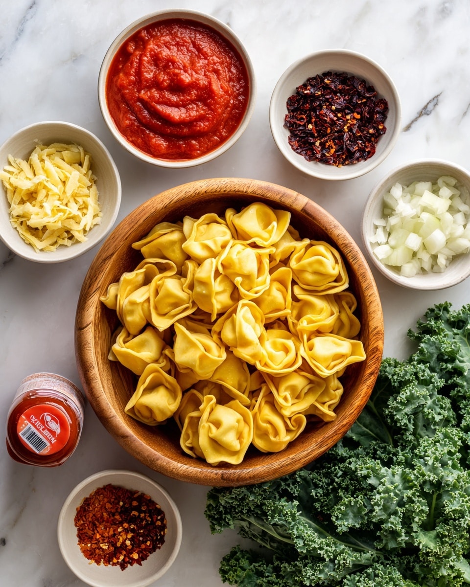 A wooden bowl filled with uncooked yellow tortellini is placed at the center on a white marbled surface. Around it, there are six small white bowls with different ingredients: a bright red smooth tomato sauce at the top left, dark red dried chili flakes next to it on the right, finely chopped pale yellow garlic below, small reddish chili flakes in a tiny bowl below that, and finely chopped white onions on the bottom right. A tube of red and white tomato paste lies diagonally near the bottom left of the bowl. Fresh, leafy green kale with curly edges is positioned at the bottom right corner. Photo taken with an iphone --ar 4:5 --v 7
