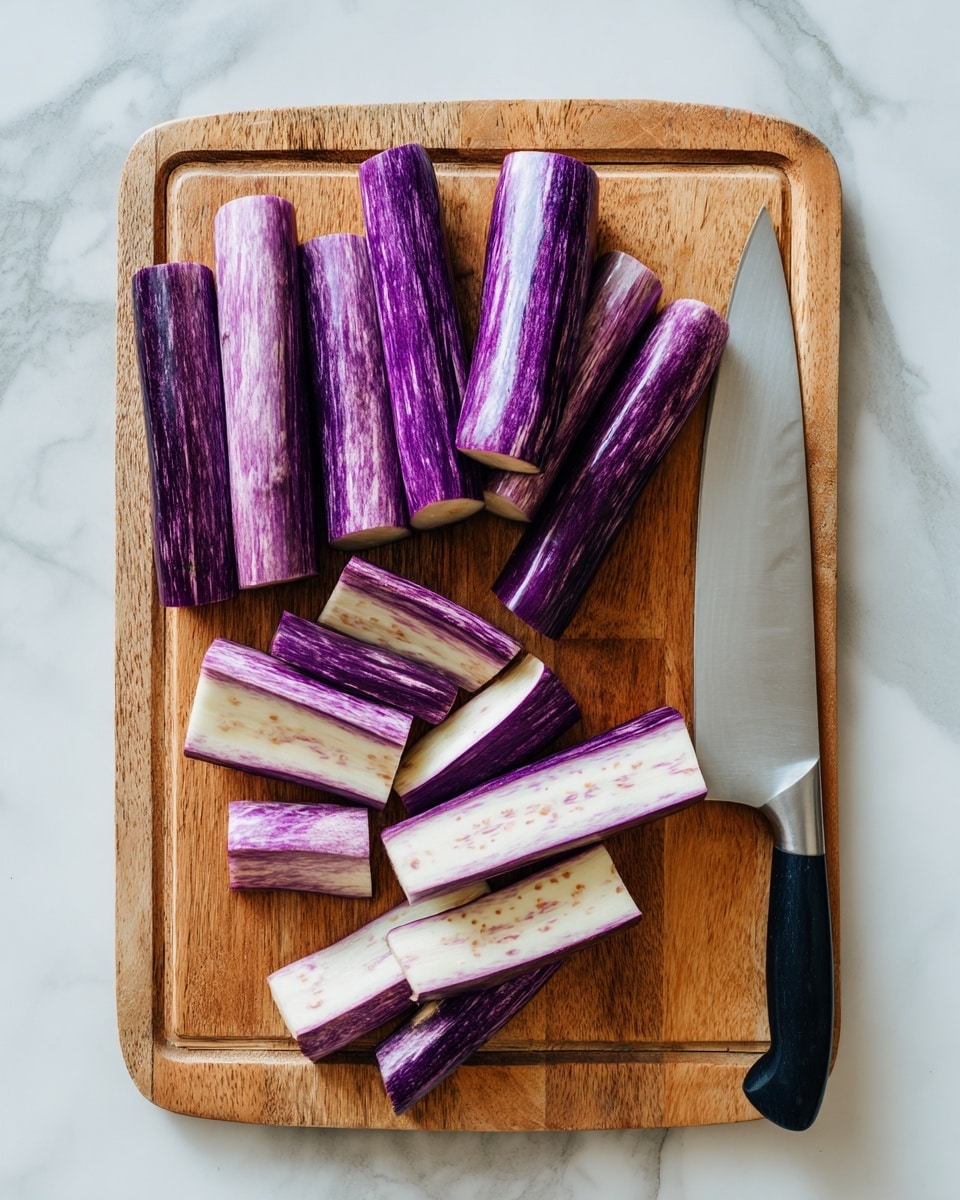 A wooden cutting board is placed on a white marbled surface. On the board are several pieces of purple eggplant cut into long, thick sticks showing their white interior with seeds. To the right side of the board is a large knife with a silver blade and a black handle resting flat. The arrangement highlights the contrast between the deep purple skin and pale flesh of the eggplants, with the smooth texture of the knife and the warm roughness of the wood. Photo taken with an iphone --ar 4:5 --v 7