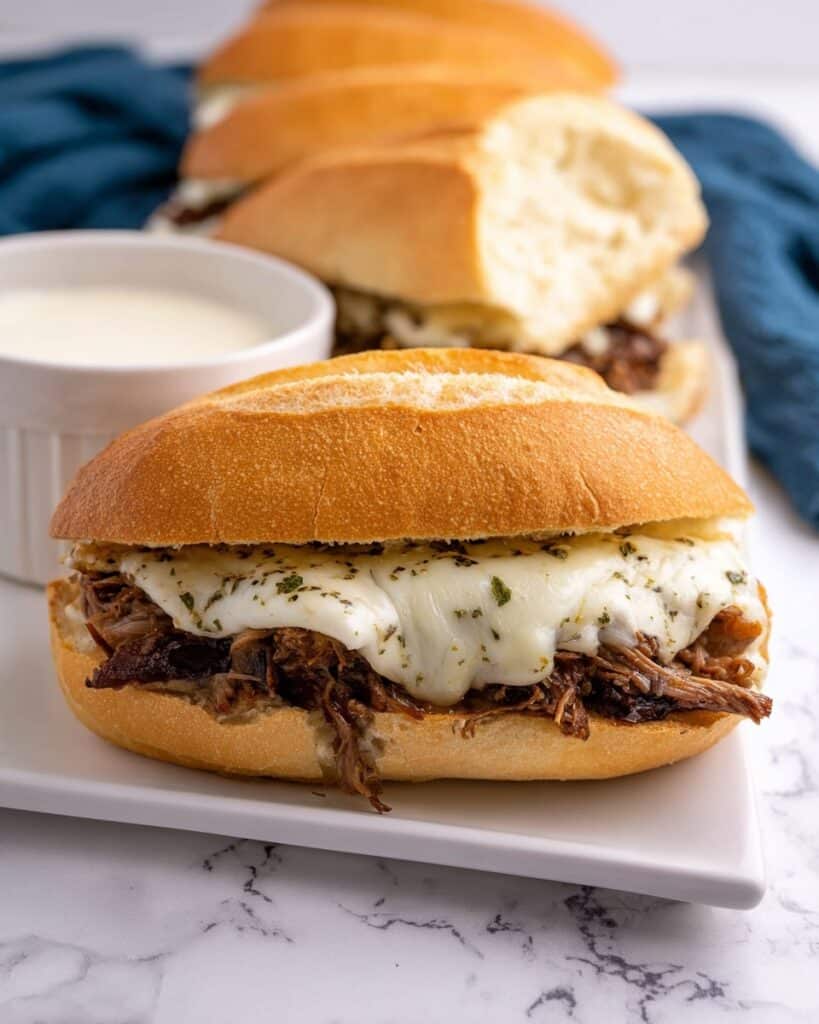 Slow Cooker French Dip Sandwiches with Provolone and Au Jus Recipe