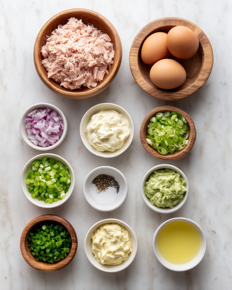 The image shows nine small white bowls and three small wooden bowls arranged neatly on a white marbled surface. From top left to right, a wooden bowl filled with light pink canned tuna flakes, next to it a wooden bowl with three whole brown eggs. Below are five white bowls containing smooth creamy mayonnaise, chopped green celery, and finely diced red onion. At the bottom left are three small wooden bowls, containing chopped green onion, coarse white salt, and ground black pepper. In the middle bottom row are three small white bowls filled with green relish, smooth yellow mustard, and pale lemon juice. The bowls are evenly spaced and labeled with black text above or below each item. The photo taken with an iphone --ar 4:5 --v 7