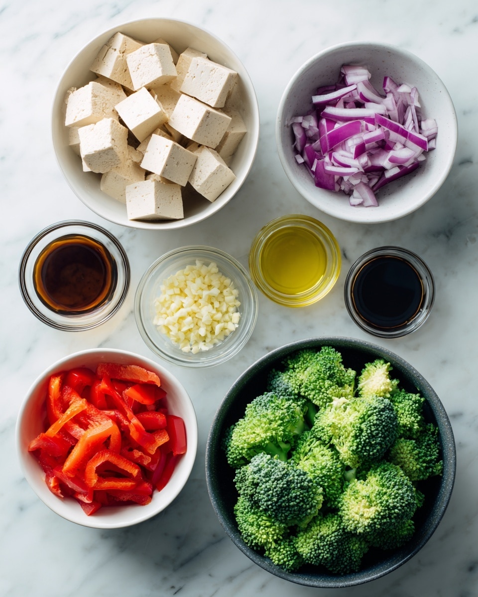 The image shows six bowls and jars on a white marbled surface. In the top left, a white bowl holds beige tofu cubes with smooth texture arranged loosely. To the right, a white bowl contains bright purple-red chopped onions with clear layers. Below, a dark gray bowl is filled with fresh green broccoli florets with bumpy texture piled high. At the bottom left, a white bowl has bright red chopped bell peppers with a shiny surface. To the right, a small white bowl holds finely chopped pale yellow garlic. Two small glass jars are positioned next to the garlic; one contains clear yellow oil, and the other has dark brown teriyaki sauce. The arrangement is neat and well spaced. Photo taken with an iphone --ar 4:5 --v 7