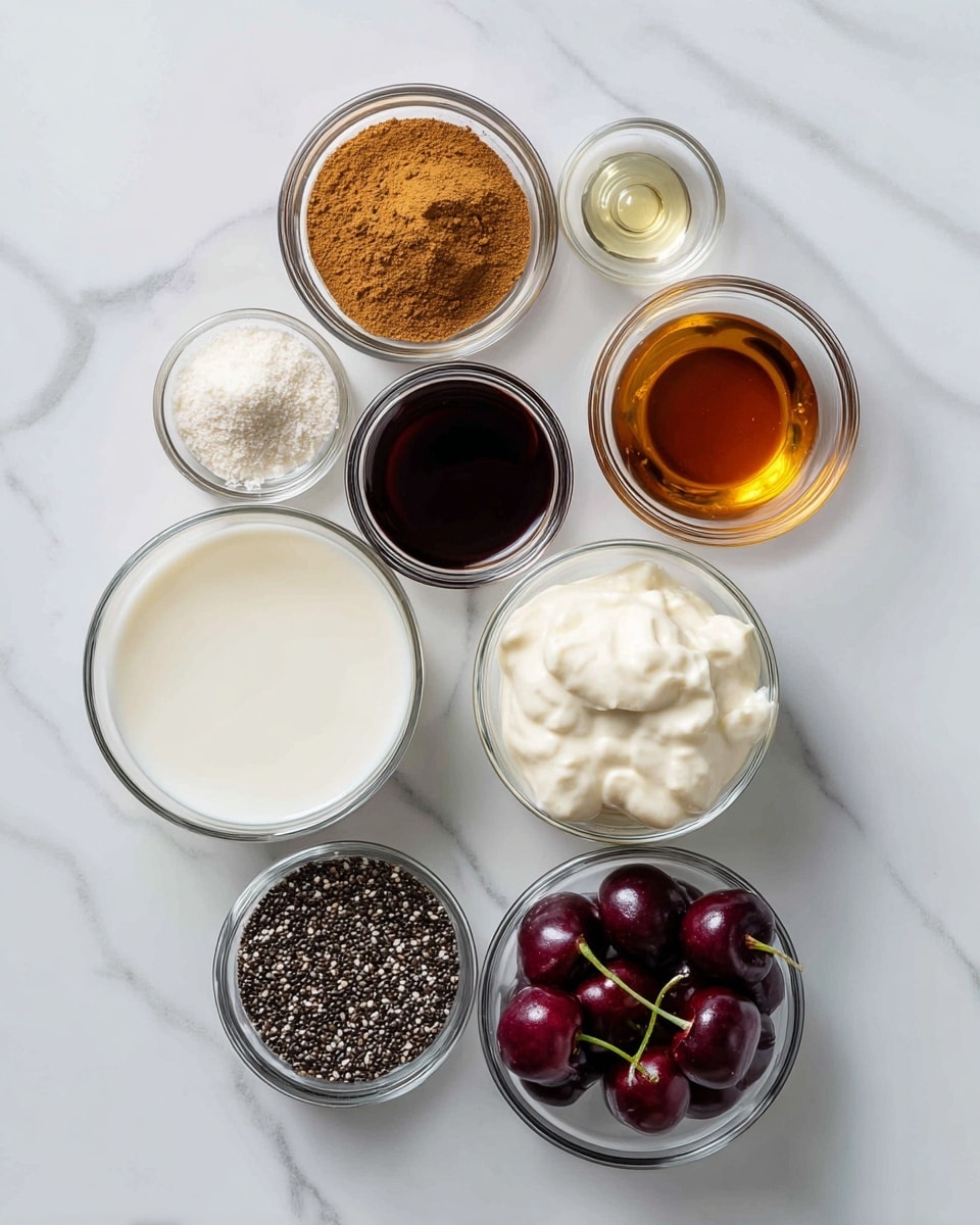 The image shows eight small clear glass bowls placed on a white marbled surface, each containing different ingredients. Starting from the top left, there is a bowl filled with light brown powder labeled cinnamon, followed to the right by a small bowl with two drops of a clear liquid labeled almond extract. Below them in the center, a bowl holds a small amount of dark brown liquid called vanilla extract. To the right is a bowl with dark amber-colored maple syrup. Below these, a larger bowl contains white liquid milk. To the left of it, another glass bowl holds white creamy yogurt. Below the cinnamon and to the left, a medium bowl is filled with black and white chia seeds. Finally, at the bottom right, there is a bowl of deep red cherries with stems. The overall scene is clean and simple, with natural lighting visible. photo taken with an iphone --ar 4:5 --v 7