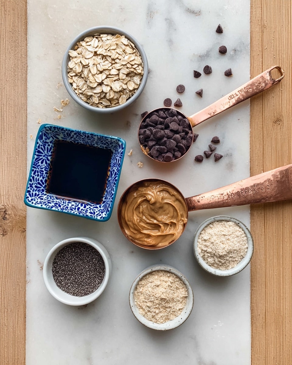 The image shows six small white bowls and measuring cups arranged on a white marbled surface. The top left bowl holds light brown rolled oats. To its right, a copper measuring cup with a wooden handle is filled with dark chocolate chips. Below, a copper measuring cup with a wooden handle is filled with smooth creamy peanut butter, and a few oats are scattered around it. In the center, there is a square white bowl with a blue flower pattern, filled with a dark liquid, likely maple syrup. On the bottom left, a white bowl contains a fine black powder, possibly ground flaxseed. At the bottom right, a small white bowl contains a beige powder, likely protein powder. The whole arrangement shows different textures and neutral colors, and a woman's fingers slightly hold the handle of the peanut butter measuring cup. photo taken with an iphone --ar 4:5 --v 7