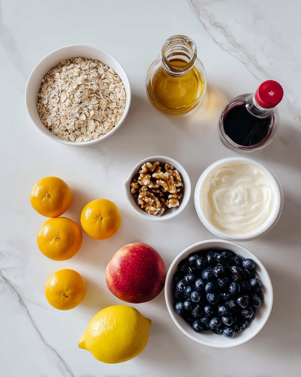 The image shows a white bowl filled with light beige oats on the left side, next to a cluster of five bright orange clementines. In the center, there is a small white bowl with brown walnuts, a tilted bottle of dark golden honey with a black cap, and a small bottle of dark vanilla extract with a red cap. To the right, a white bowl is full of dark blue blueberries. Above it, a bright yellow lemon and a red apple with shades of yellow sit side by side. On the far right, a white container of honey vanilla Greek yogurt lies on its side showing the label. All items are placed on a smooth white marbled surface. Photo taken with an iphone --ar 4:5 --v 7